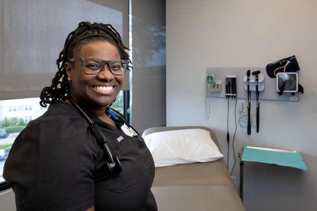 Black female doctor in examination room